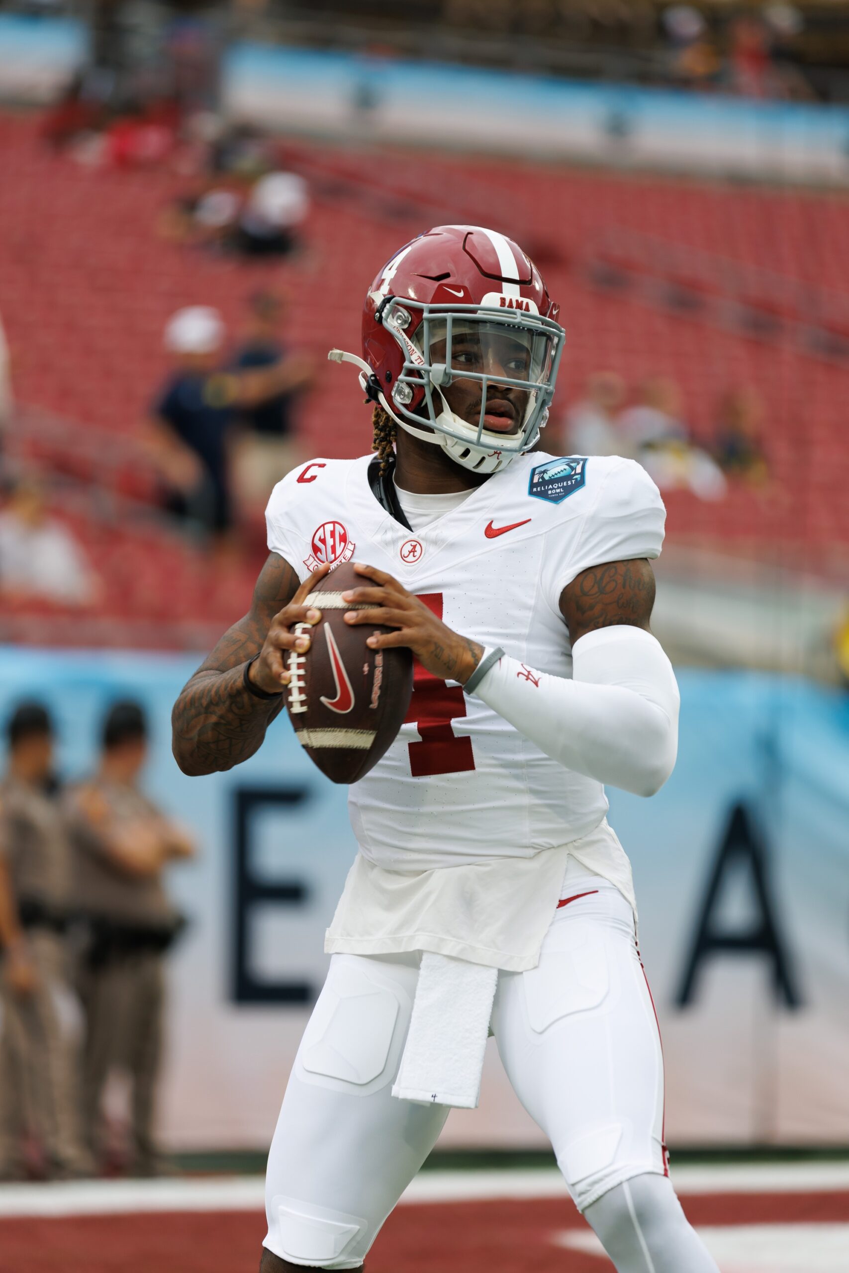 Dec 31, 2024; Tampa, FL, USA; Alabama Crimson Tide quarterback Jalen Milroe (4) looks to throw before a game against the Michigan Wolverines at Raymond James Stadium. Mandatory Credit: Matt Pendleton-Imagn Images