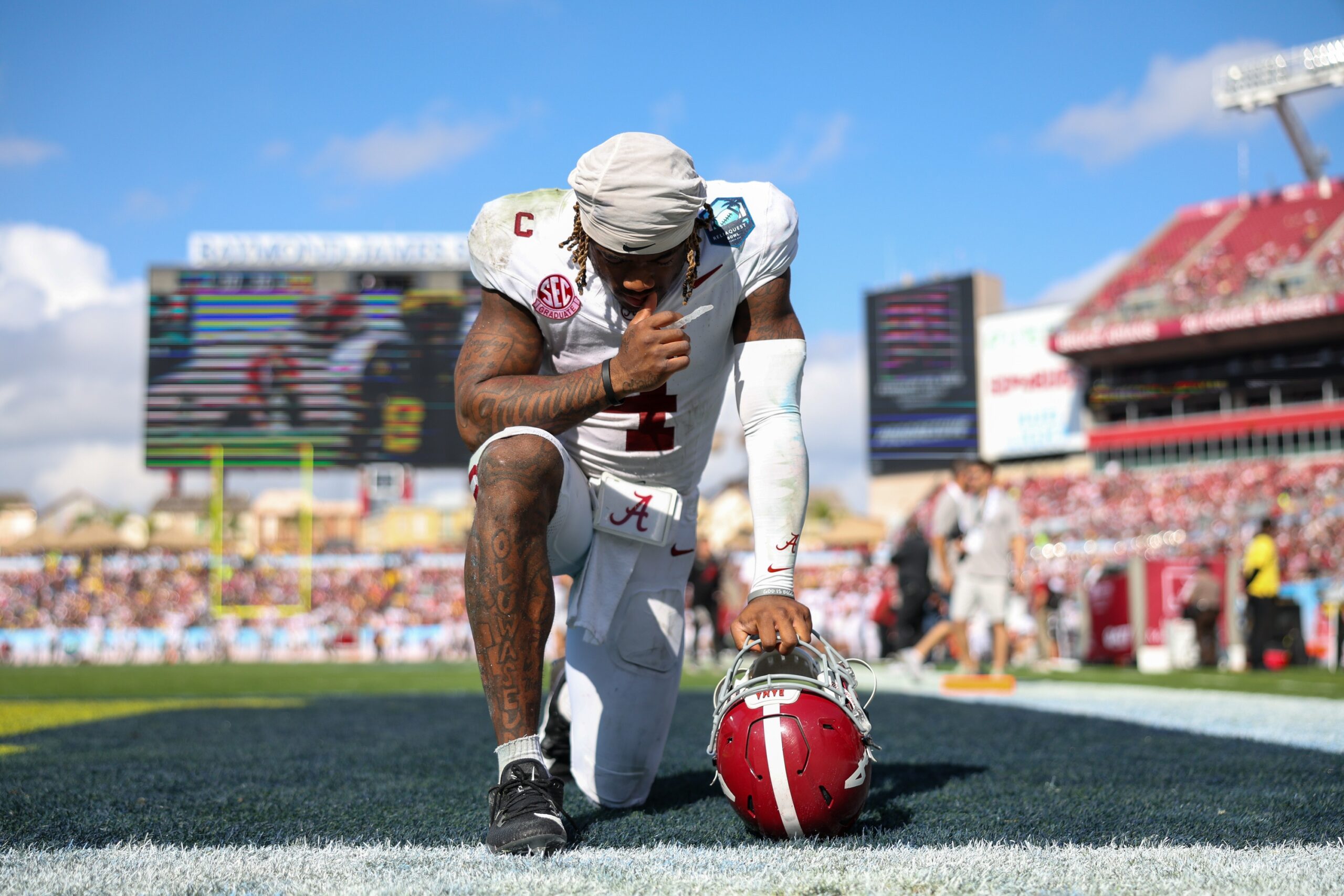 Dec 31, 2024; Tampa, FL, USA; Alabama Crimson Tide quarterback Jalen Milroe (4) gets ready to play the third quarter against the Michigan Wolverines during the ReliaQuest Bowl at Raymond James Stadium. Mandatory Credit: Nathan Ray Seebeck-Imagn Images