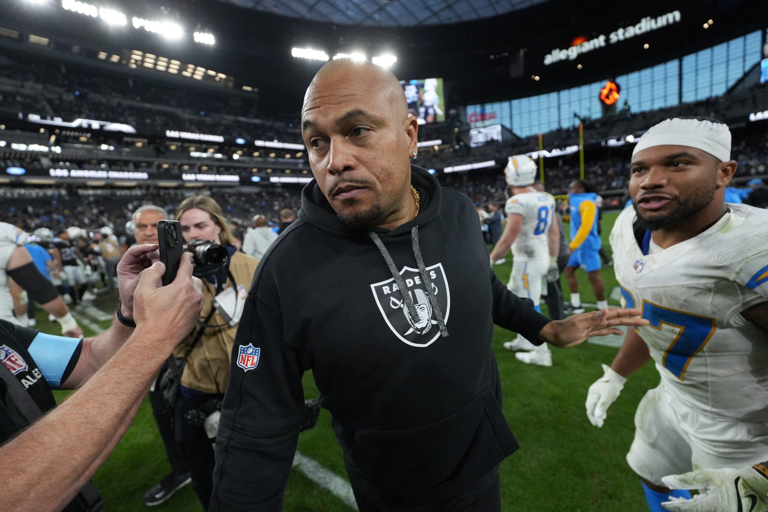 Jan 5, 2025; Paradise, Nevada, USA; Las Vegas Raiders coach Antonio Pierce leaves the field after the game against the Los Angeles Chargers at Allegiant Stadium. Mandatory Credit: Kirby Lee-Imagn Images