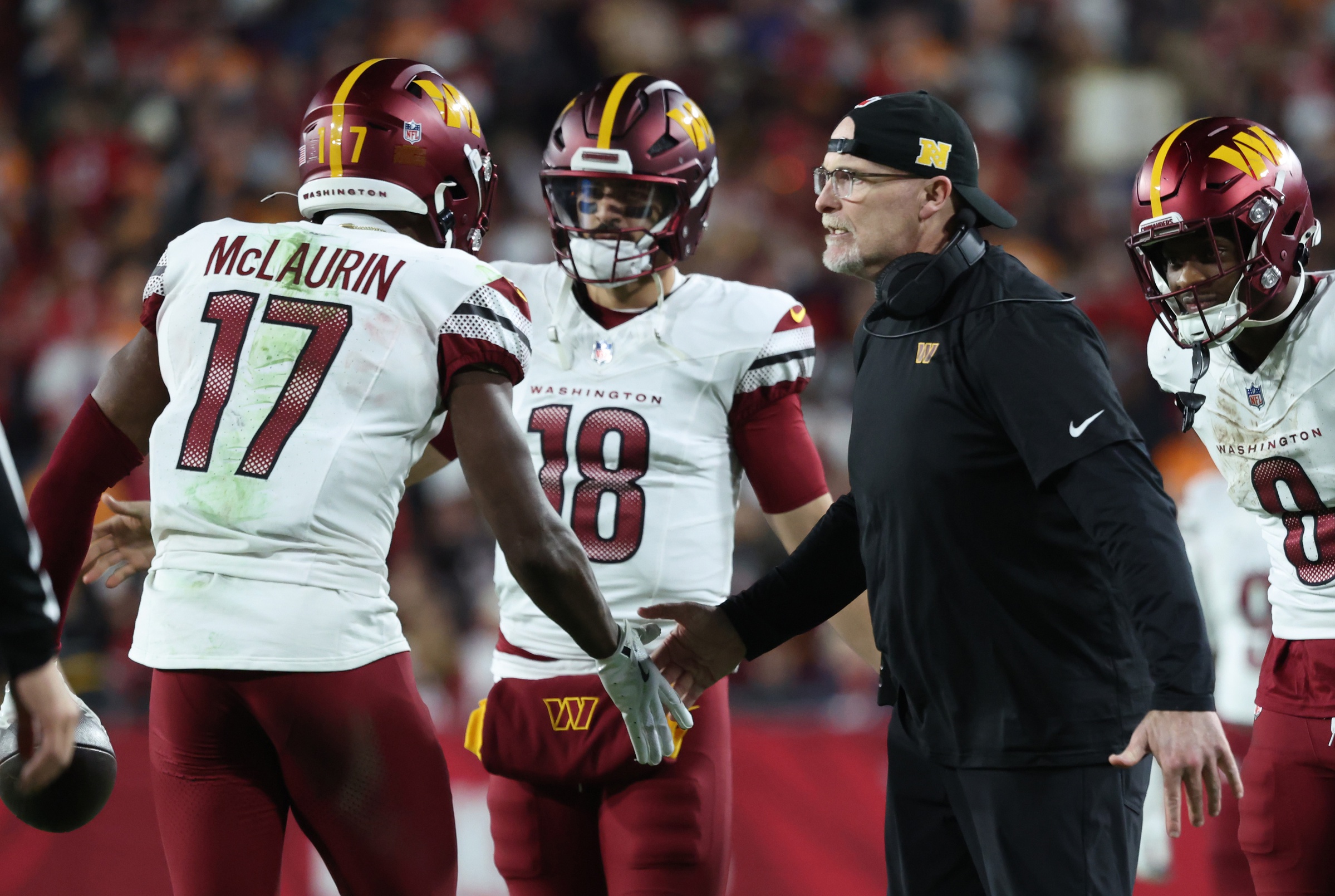 Washington Commanders wide receiver Terry McLaurin (17) celebrates with head coach Dan Quinn