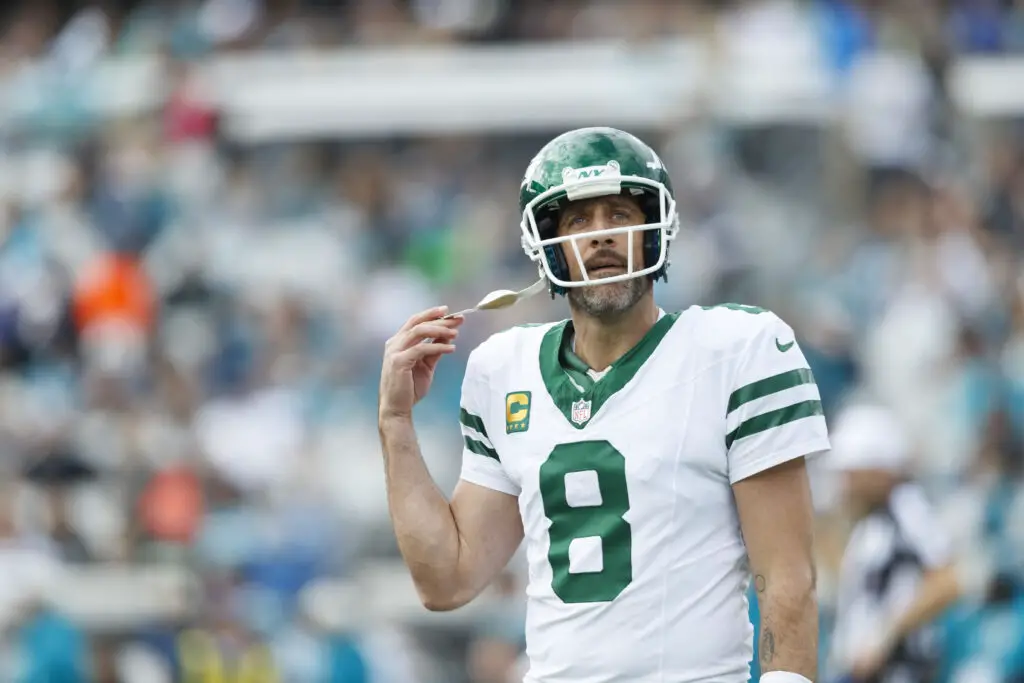 Dec 15, 2024; Jacksonville, Florida, USA; New York Jets quarterback Aaron Rodgers (8) reacts after a missed throw against the Jacksonville Jaguars during the first quarter at EverBank Stadium. Mandatory Credit: Morgan Tencza-Imagn Images