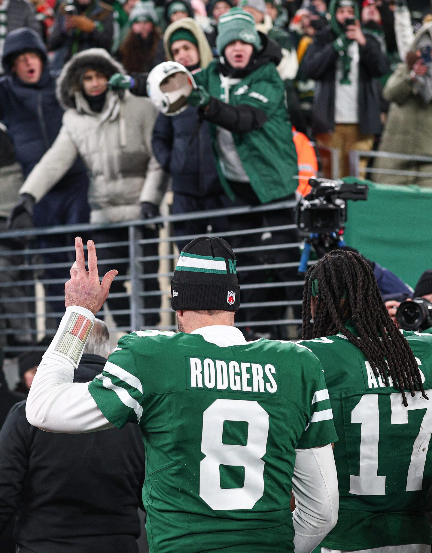 Jan 5, 2025; East Rutherford, New Jersey, USA; New York Jets quarterback Aaron Rodgers (8) walks off the field with wide receiver Davante Adams (17) after the game against the Miami Dolphins at MetLife Stadium. Mandatory Credit: Vincent Carchietta-Imagn Images