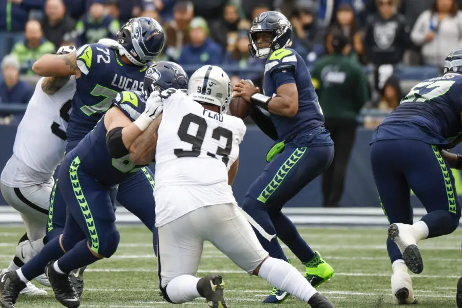 Nov 27, 2022; Seattle, Washington, USA; Seattle Seahawks quarterback Geno Smith (7) looks to pass against the Las Vegas Raiders during the second quarter at Lumen Field. Mandatory Credit: Joe Nicholson-Imagn Images
