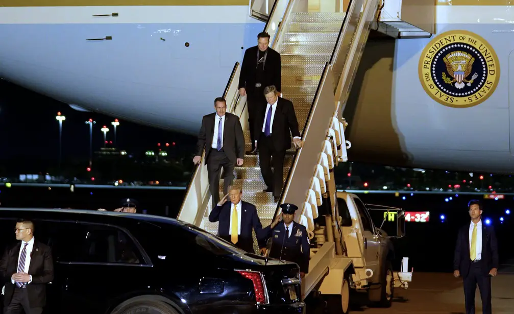 President Donald Trump exits Air Force One with Elon Musk, top, and Melania Trump's father, Viktor Knavs, middle right, at Palm Beach International Airport in West Palm Beach, Florida on March 7, 2025. Trump is staying at his Mar-a-Lago home in Palm Beach. © GREG LOVETT/PALM BEACH POST / USA TODAY NETWORK via Imagn Images Eagles