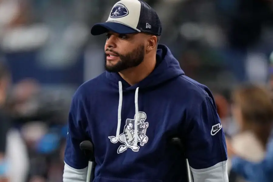 Nov 28, 2024; Arlington, Texas, USA; Dallas Cowboys quarterback Dak Prescott (left) stands on crutches before the game against the New York Giants at AT&T Stadium. Mandatory Credit: Chris Jones-Imagn Images