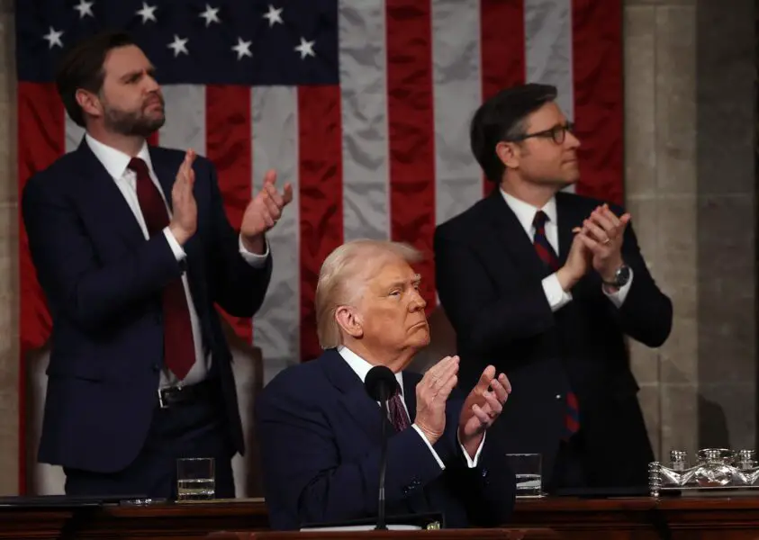 JD Vance gifts Pope Leo XIV Bears jersey during visit 3 Mar 4, 2025; Washington, DC, USA; U.S. President Donald Trump addresses a joint session of Congress at the U.S. Capitol on March 04, 2025 in Washington, DC. Vice President JD Vance and Speaker of the House Mike Johnson (R-LA) applaud behind him. President Trump was expected to address Congress on his early achievements of his presidency and his upcoming legislative agenda. Mandatory Credit: Win McNamee-Pool via Imagn Images