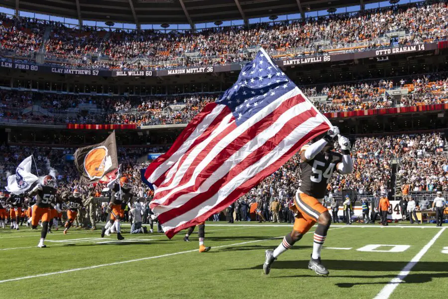 Darrell Doucette insists flag football stars spearhead Team USA's gold hunt in Olympics 2 Cleveland Browns defensive end Ogbo Okoronkwo (54) runs onto the field carrying an American flag for Salute to Service during team introductions before the game against the Los Angeles Chargers at Huntington Bank Field. Mandatory Credit: Scott Galvin-Imagn Images