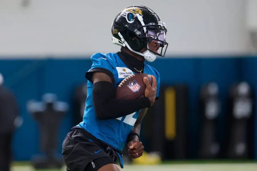 Jacksonville Jaguars wide receiver Travis Hunter (12) runs the ball during the 10th organized team activity at Miller Electric Center Wednesday, June 4, 2025 in Jacksonville, Fla. [Corey Perrine/Florida Times-Union]