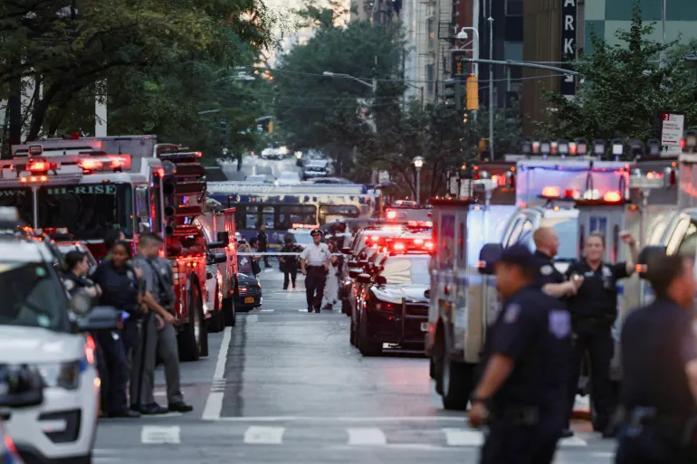 Police officers gather during a reported active shooter situation in the Manhattan borough of New York City, the United States [Jeenah Moon/Reuters]