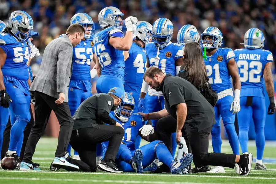 Detroit Lions staff check on the injury of defensive end Levi Onwuzurike (91) during the first half against Chicago Bears