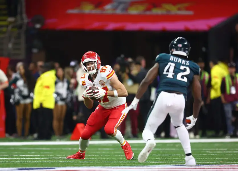 Feb 9, 2025; New Orleans, LA, USA; Kansas City Chiefs tight end Travis Kelce (87) catches a pass against Philadelphia Eagles linebacker Oren Burks (42) in the fourth quarter in Super Bowl LIX at Ceasars Superdome. Mandatory Credit: Mark J. Rebilas-Imagn Images