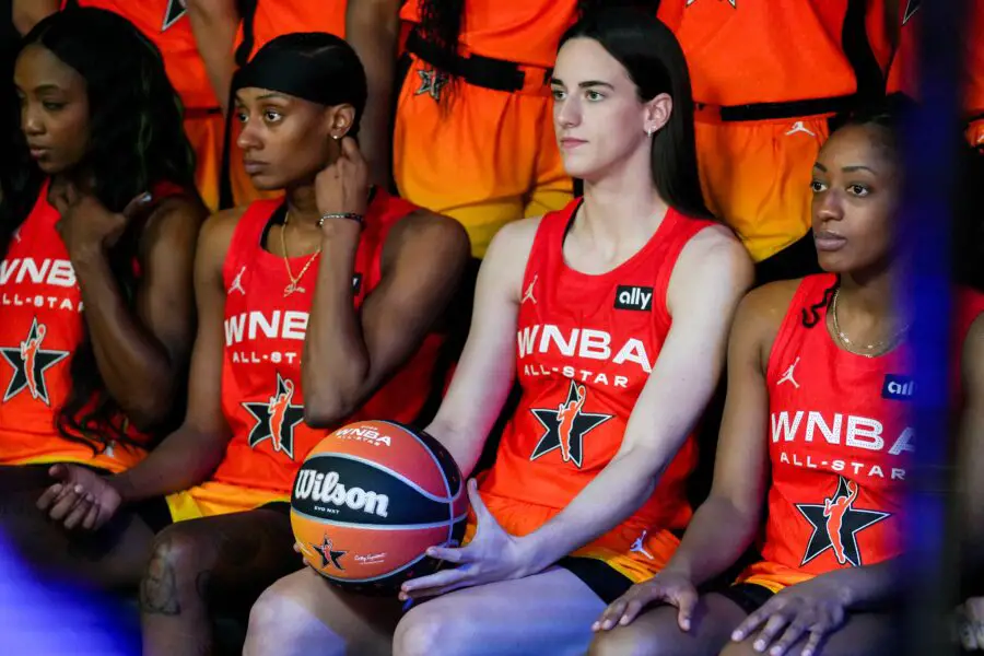 'A Group Of Simple-Minded Communists': WNBA's 'Pay Us What You Owe Us' Shirts Receive Jason Whitlock's Ire 3 Indiana Fever's Caitlin Clark (22) poses with her team before the 2025 WNBA All-Star Game on Saturday