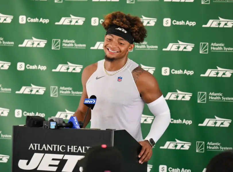 Jul 23, 2025; Florham Park, NY, USA; New York Jets quarterback Justin Fields (7) speaks at a press conference during training camp at Atlantic Health Jets Training Center. Mandatory Credit: John Jones-Imagn Images