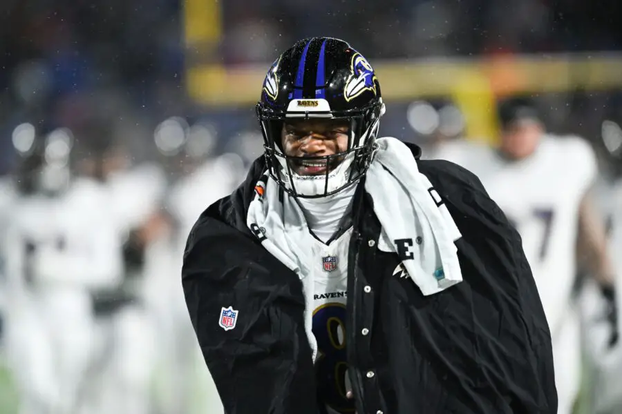 Jan 19, 2025; Orchard Park, New York, USA; Baltimore Ravens quarterback Lamar Jackson (8) smiles during warm ups before the game against the Buffalo Bills in a 2025 AFC divisional round game at Highmark Stadium. Mandatory Credit: Mark Konezny-Imagn Images