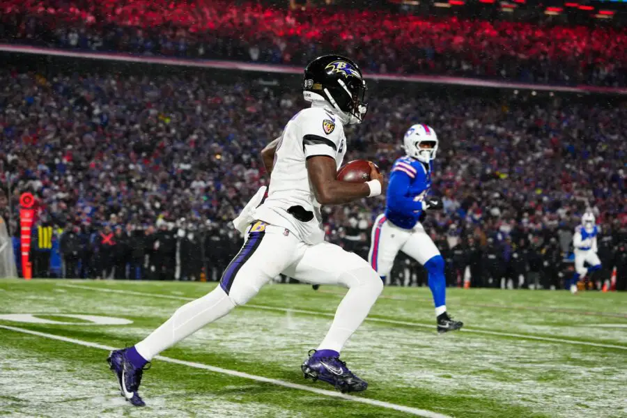 Jan 19, 2025; Orchard Park, New York, USA; Baltimore Ravens quarterback Lamar Jackson (8) runs the ball during the fourth quarter against the Buffalo Bills in a 2025 AFC divisional round game at Highmark Stadium. Mandatory Credit: Gregory Fisher-Imagn Images