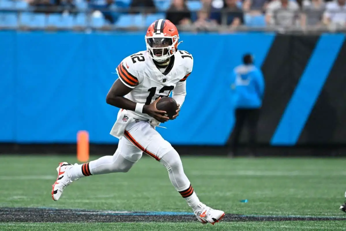 Aug 8, 2025; Charlotte, North Carolina, USA; Cleveland Browns quarterback Shedeur Sanders (12) with the ball in the first quarter at Bank of America Stadium. Mandatory Credit: Bob Donnan-Imagn Images
