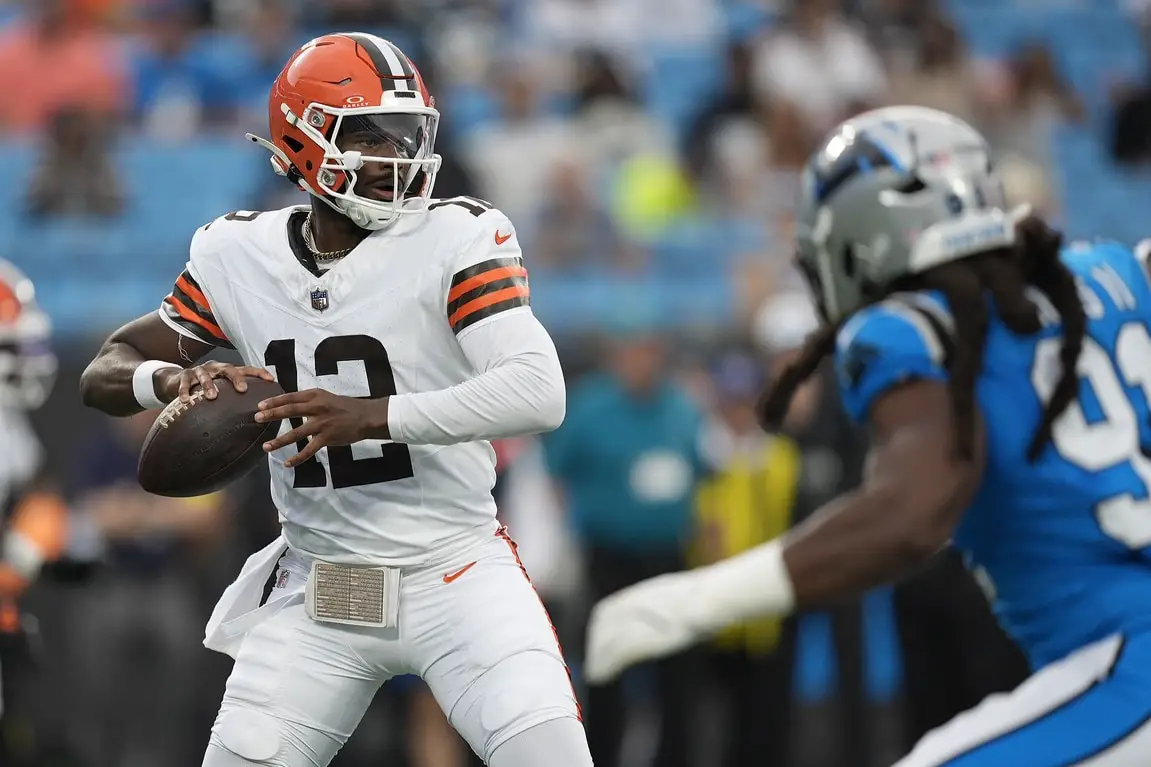 Aug 8, 2025; Charlotte, North Carolina, USA; Cleveland Browns quarterback Shedeur Sanders (12)j drops back to pass against the Carolina Panthers during the first quarter at Bank of America Stadium. Mandatory Credit: Jim Dedmon-Imagn Images