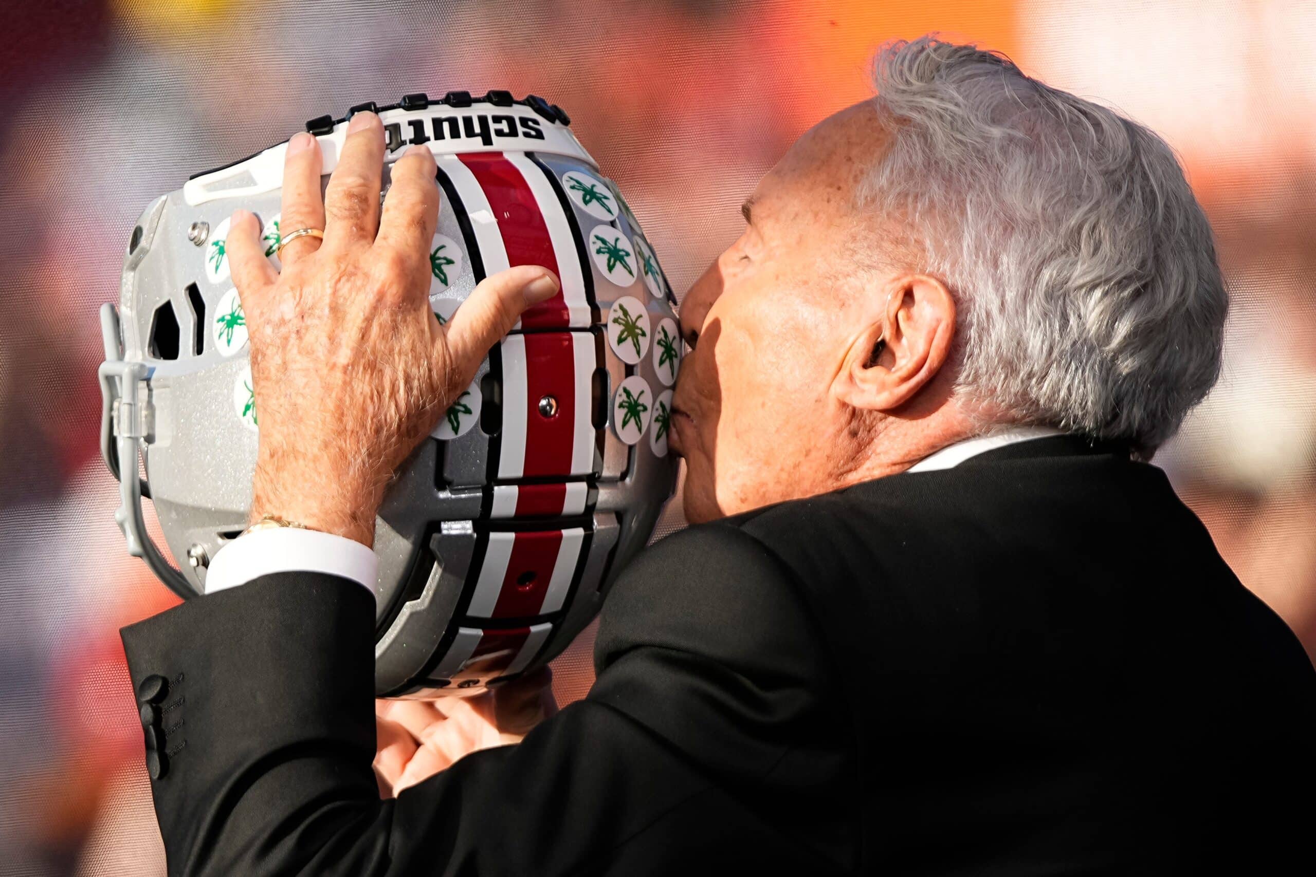 Lee Corso kisses a Buckeye helmet on the set of ESPN College GameDay prior to the NCAA football game between the Ohio State Buckeyes and the Texas Longhorns at Ohio Stadium on Aug. 30, 2025.