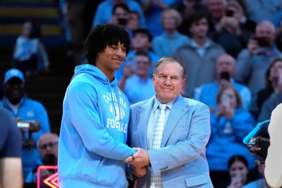 Bill Belichick's Tar Heels land massive 340-Pound DT 1 Dec 14, 2024; Chapel Hill, North Carolina, USA; North Carolina Tar Heels head football coach Bill Belichick with recruit quarterback Bryce Baker during half time at Dean E. Smith Center. Mandatory Credit: Bob Donnan-Imagn Images