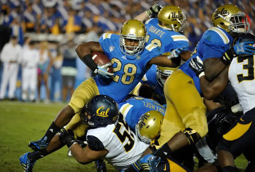 Bill Belichick's Tar Heels land massive 340-Pound DT 3 Oct 12, 2013; Pasadena, CA, USA; UCLA Bruins running back Malcolm Jones (28) is tripped up by California Golden Bears defensive lineman Viliami Moala (55) near the goal line during fourth quarter action at Rose Bowl. Mandatory Credit: Robert Hanashiro-Imagn Images