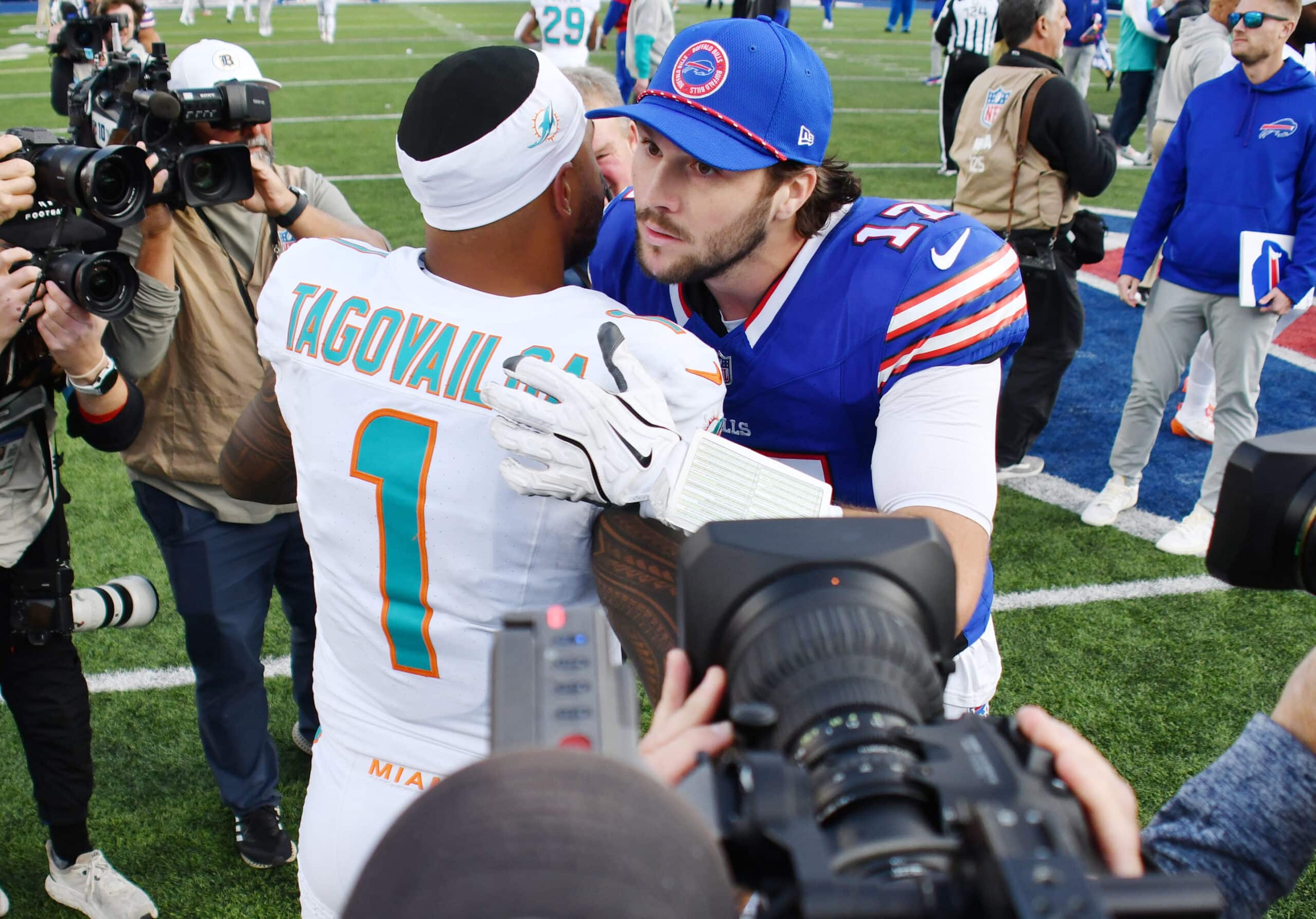 Nov 3, 2024; Orchard Park, New York, USA; Buffalo Bills quarterback Josh Allen (17) greets Miami Dolphins quarterback Tua Tagovailoa (1) after a game at Highmark Stadium. Mandatory Credit: Mark Konezny-Imagn Images
