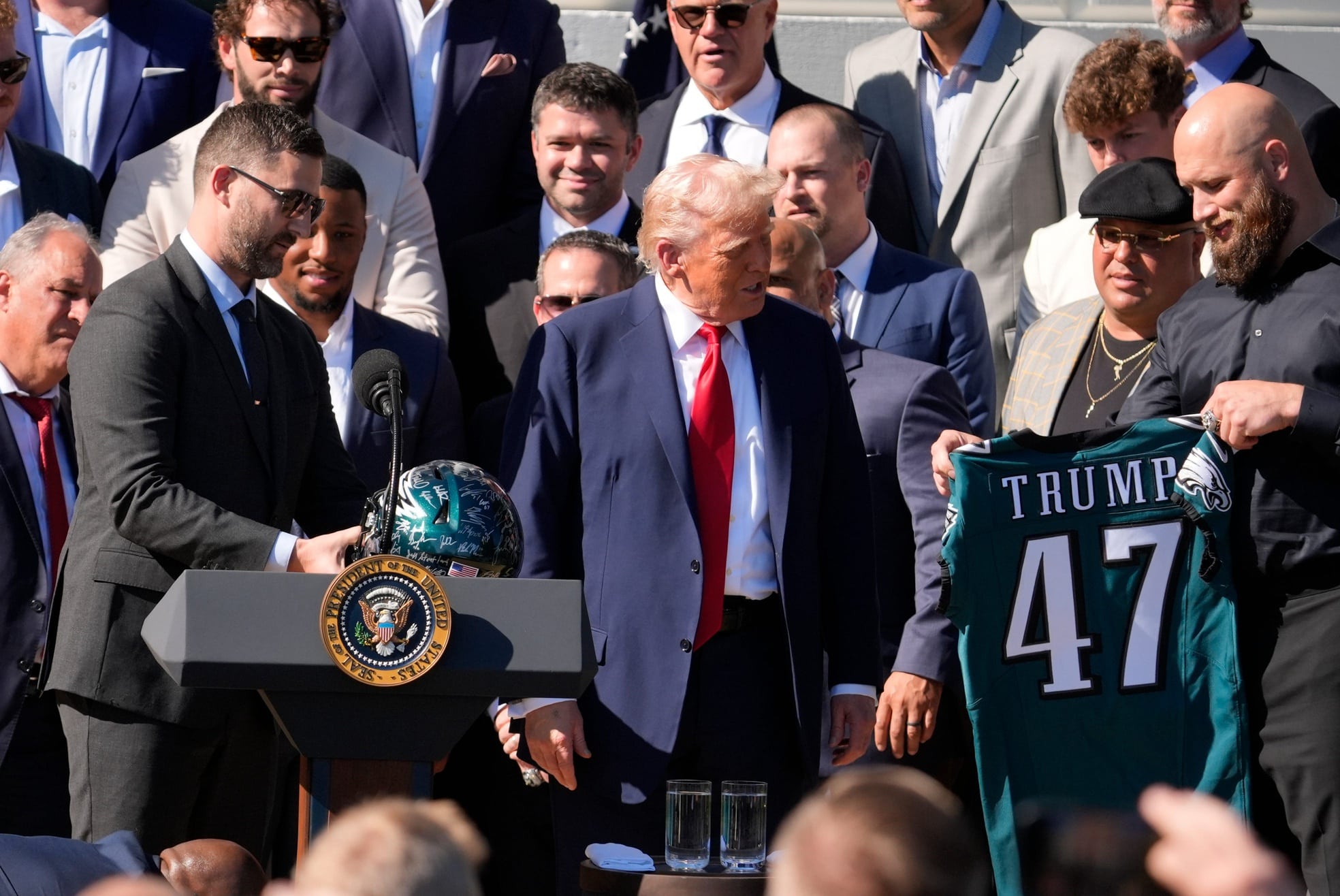 Apr 28, 2025; Washington, DC, USA; Philadelphia Eagles’ head coach Nick Sirianni, left, and offensive tackle Lane Johnson stand next to President Donald Trump as he honors the Super Bowl LIX champion Philadelphia Eagles at The White House in Washington D.C., on April 28, 2025.