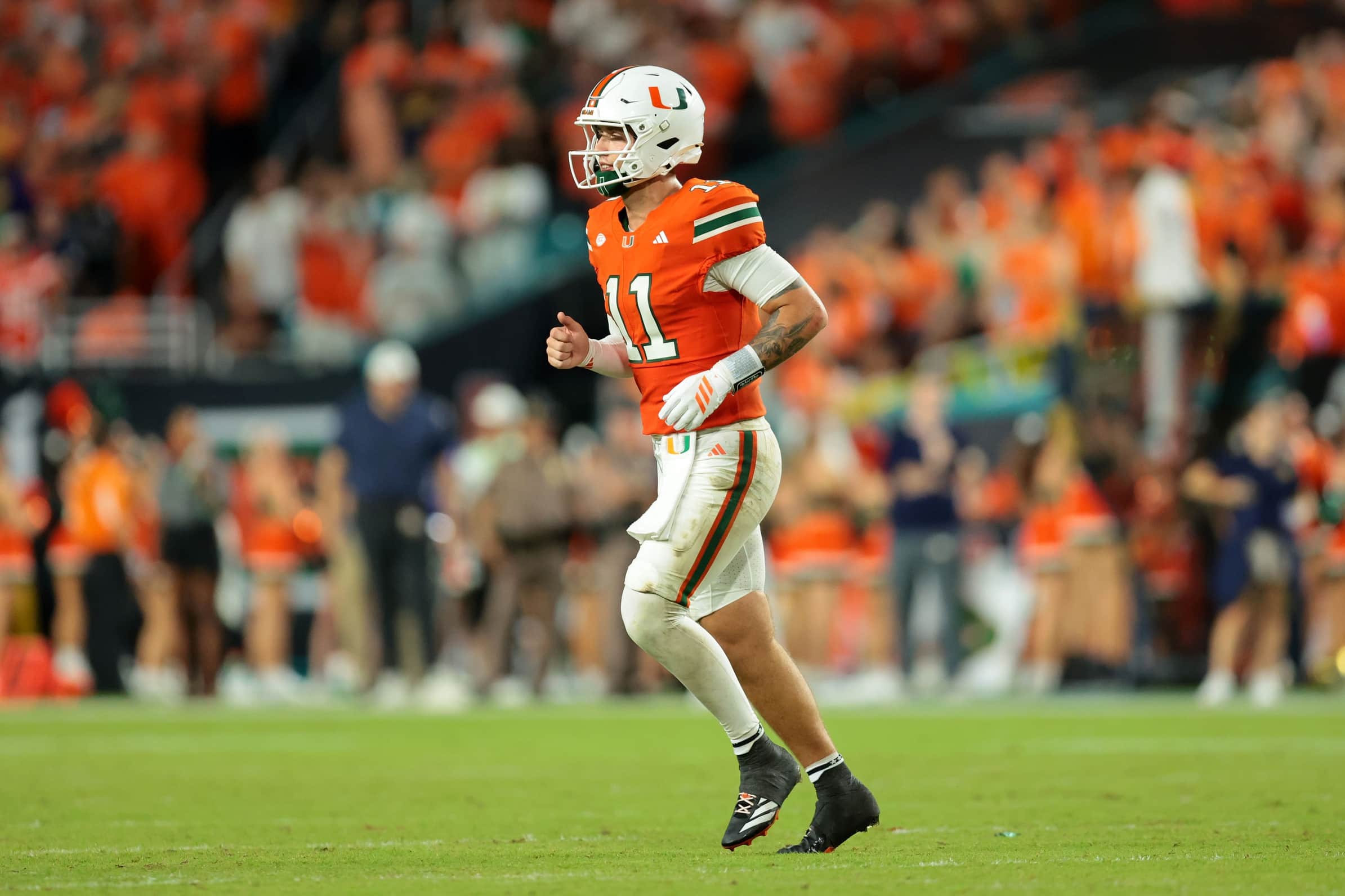 Aug 31, 2025; Miami Gardens, Florida, USA; Miami Hurricanes quarterback Carson Beck (11) during the third quarter at Hard Rock Stadium. Mandatory Credit: Sam Navarro-Imagn Images
