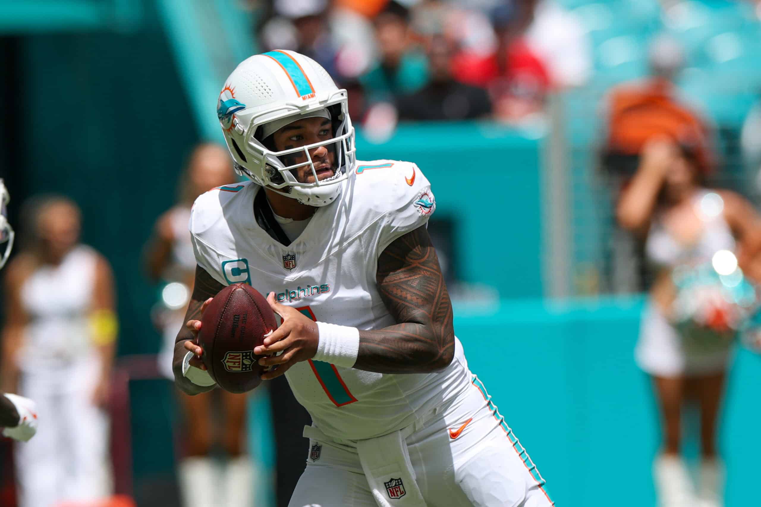 Sep 14, 2025; Miami Gardens, Florida, USA; Miami Dolphins quarterback Tua Tagovailoa (1) looks to pass against the New England Patriots in the first quarter at Hard Rock Stadium. Mandatory Credit: Nathan Ray Seebeck-Imagn Images