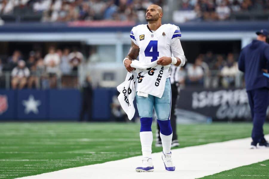 Sep 14, 2025; Arlington, Texas, USA; Dallas Cowboys quarterback Dak Prescott (4) reacts on the sideline during overtime against the New York Giants at AT&T Stadium. Mandatory Credit: Kevin Jairaj-Imagn Images