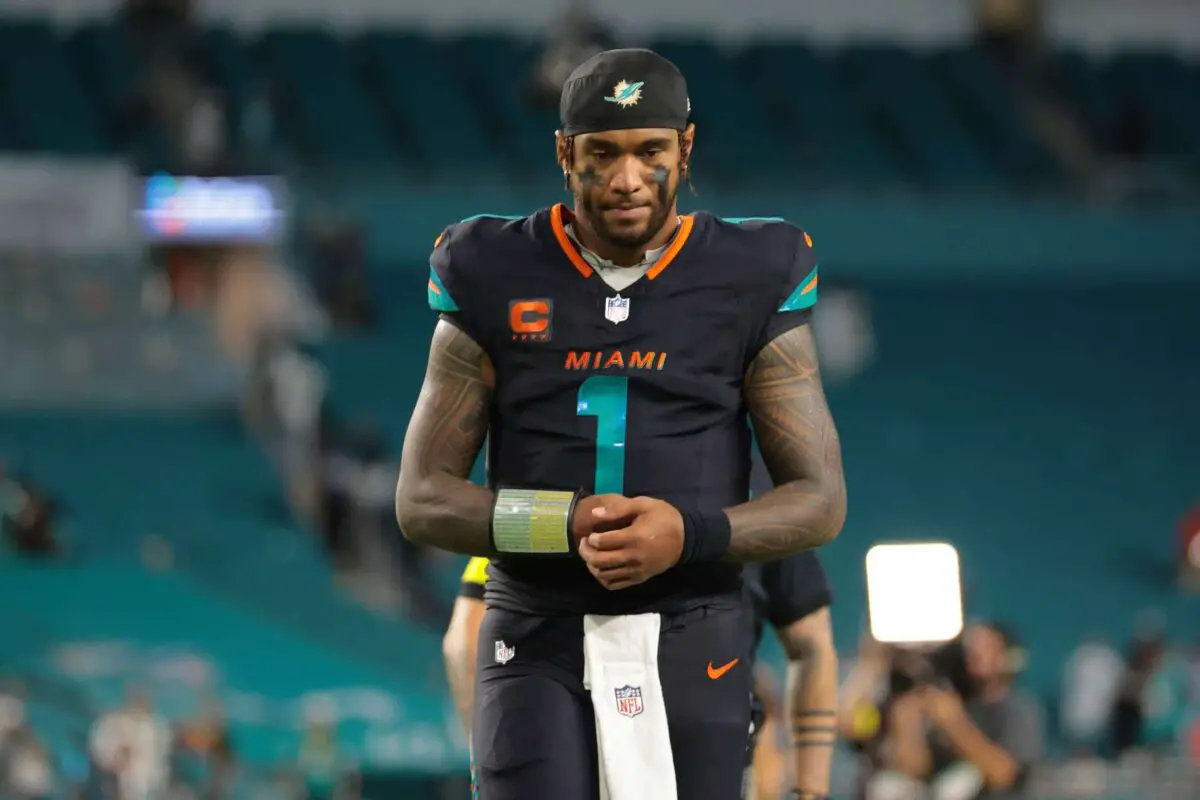 Sep 29, 2025; Miami Gardens, Florida, USA;Miami Dolphins quarterback Tua Tagovailoa (1) walks off the field after the game against the New York Jets at Hard Rock Stadium. Mandatory Credit: Sam Navarro-Imagn Images