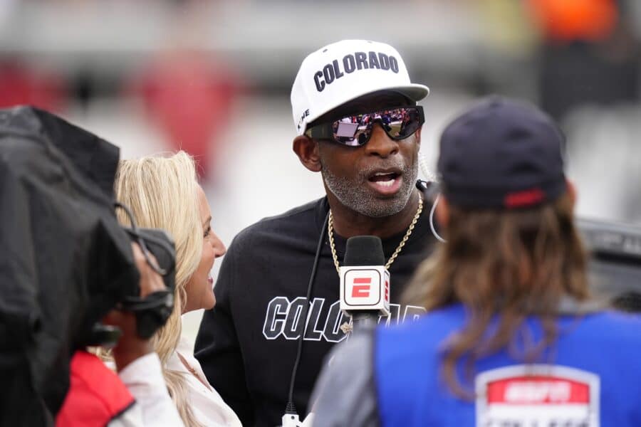 Oct 11, 2025; Boulder, Colorado, USA; Colorado Buffaloes head coach Deion Sanders is interviewed by ESPN during a time out in the first quarter against the Iowa State Cyclones at Folsom Field. Mandatory Credit: Ron Chenoy-Imagn Images