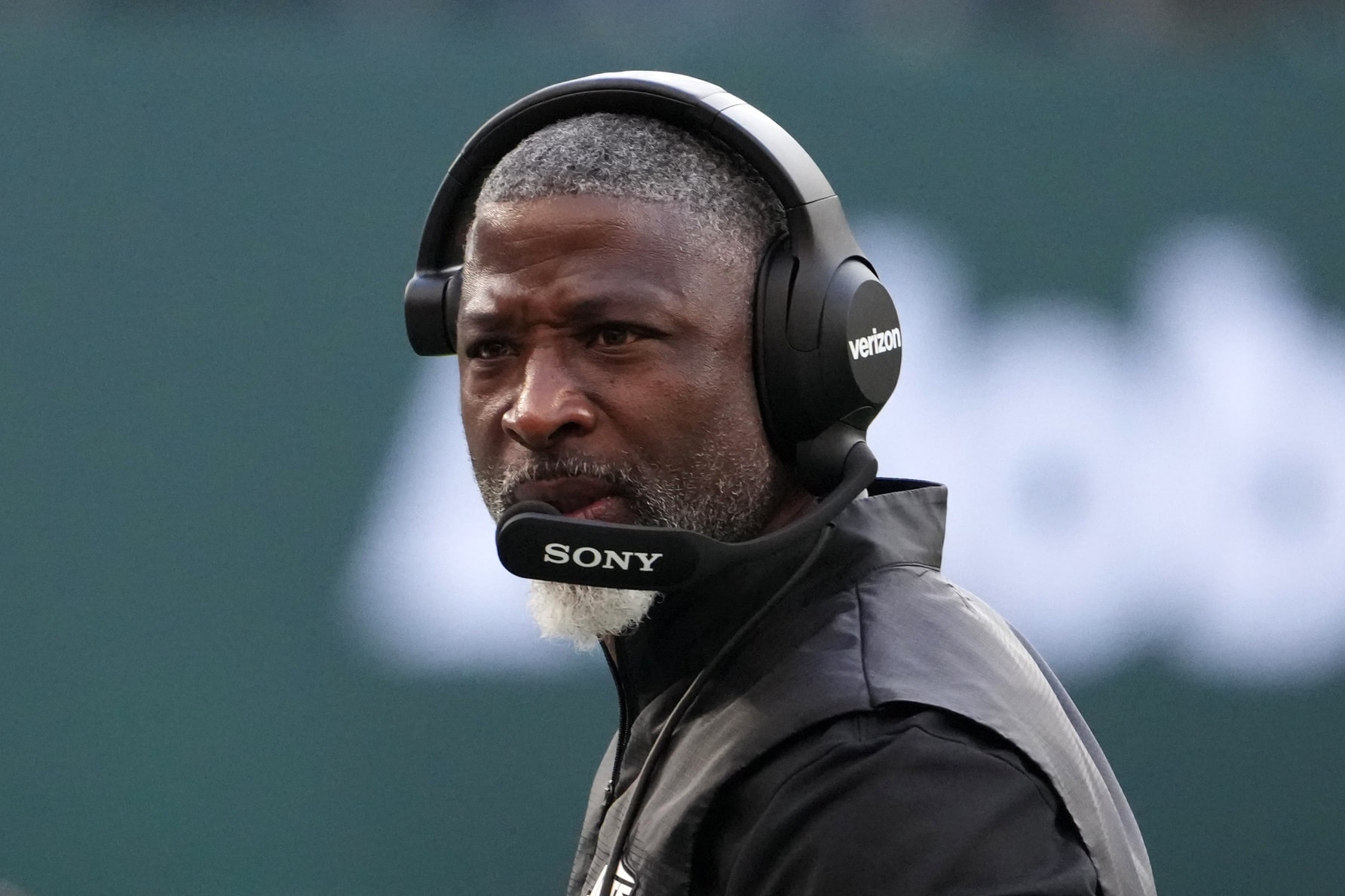 Oct 12, 2025; Tottenham, United Kingdom; New York Jets head coach Aaron Glenn watches from the sidelines in the second half during an NFL International Series game against the Denver Broncos at Tottenham Hotspur Stadium. Mandatory Credit: Kirby Lee-Imagn Images