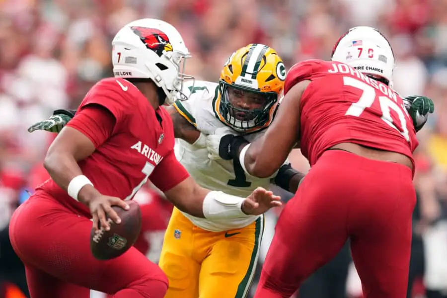 Oct 19, 2025; Glendale, Arizona, USA; Green Bay Packers defensive end Micah Parsons (1) pursues Arizona Cardinals quarterback Jacoby Brissett (7) during the first half at State Farm Stadium. Mandatory Credit: Joe Camporeale-Imagn Images