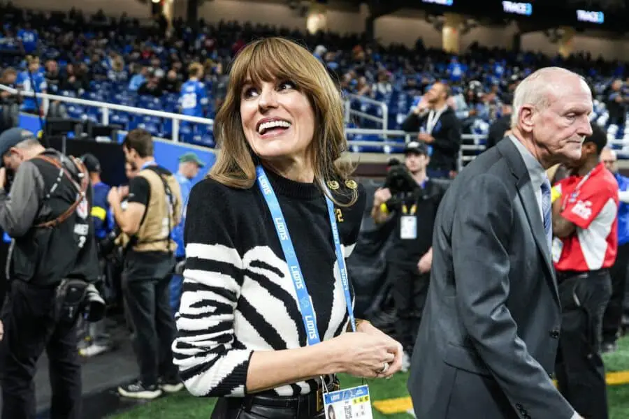 Holly Campbell, Detroit Lions head coach Dan Campbell ’s wife, waves at fans during warm up ahead of the Tampa Bay Buccaneers game at Ford Field in Detroit on Monday, Oct. 20, 2025.
