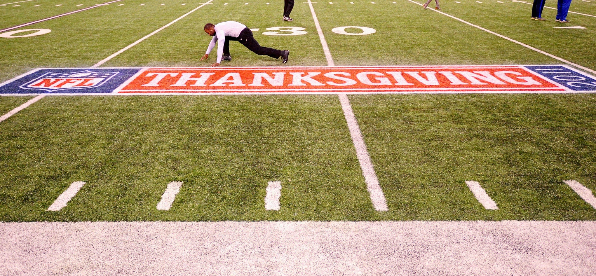 November 24, 2011; Baltimore, MD, USA; Baltimore Ravens wide receiver Anquan Boldin stretches above the Thanksgiving logo prior to the game against the San Francisco 49ers at M&T Bank Stadium. Mandatory Credit: Evan Habeeb-USA TODAY Sports