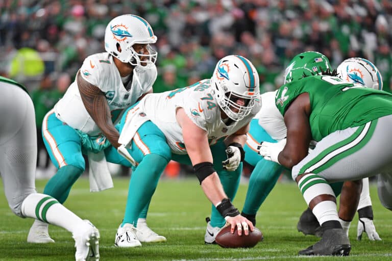 Oct 22, 2023; Philadelphia, Pennsylvania, USA; Miami Dolphins offensive tackle Liam Eichenberg (74) snaps the ball to quarterback Tua Tagovailoa (1) against the Philadelphia Eagles at Lincoln Financial Field. Mandatory Credit: Eric Hartline-Imagn Images