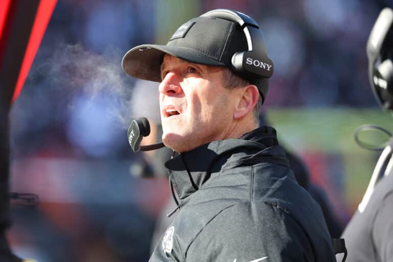 Dec 14, 2025; Cincinnati, Ohio, USA; Baltimore Ravens head coach John Harbaugh checks a replay during the second quarter against the Cincinnati Bengals at Paycor Stadium. Mandatory Credit: Joseph Maiorana-Imagn Images