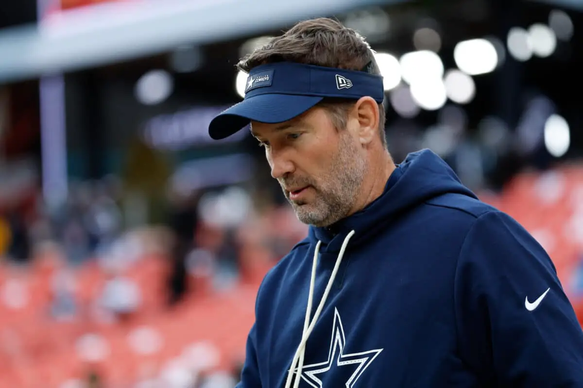 Dec 25, 2025; Landover, Maryland, USA; Dallas Cowboys head coach Brian Schottenheimer looks on during warmups before the game against the Washington Commanders at Northwest Stadium. Mandatory Credit: Amber Searls-Imagn Images