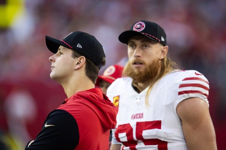 Jan 5, 2025; Glendale, Arizona, USA; San Francisco 49ers quarterback Brock Purdy (left) with tight end George Kittle (85) against the Arizona Cardinals at State Farm Stadium. Mandatory Credit: Mark J. Rebilas-Imagn Images