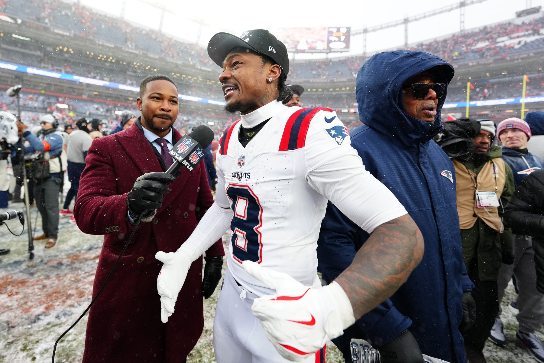 Jan 25, 2026; Denver, CO, USA; New England Patriots wide receiver Stefon Diggs (8) speaks to the media after defeating the Denver Broncos in the 2026 AFC Championship Game at Empower Field at Mile High. Mandatory Credit: Ron Chenoy-Imagn Images